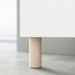 Single IKEA MEJARP birch leg supporting a white BESTÅ furniture combination side view