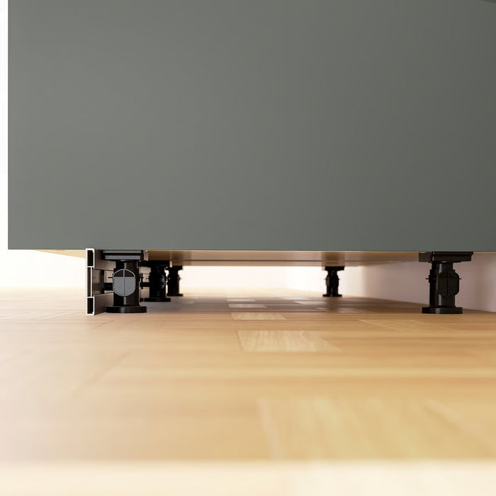 IKEA METOD cabinet legs installed under kitchen base cabinet showing height adjustment on uneven floor