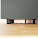 IKEA METOD cabinet legs installed under kitchen base cabinet showing height adjustment on uneven floor