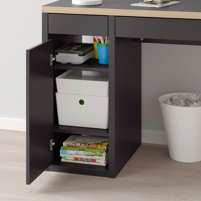 IKEA MICKE desk cabinet open showing internal adjustable shelf with storage bins and books