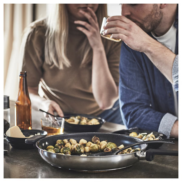 IKEA MIDDAGSMAT frying pan with roasted brussels sprouts served at dining table