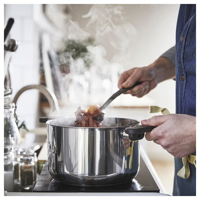  IKEA MIDDAGSMAT pot with tongs and steam rising stir-fry cooking in use