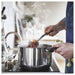  IKEA MIDDAGSMAT pot with tongs and steam rising stir-fry cooking in use