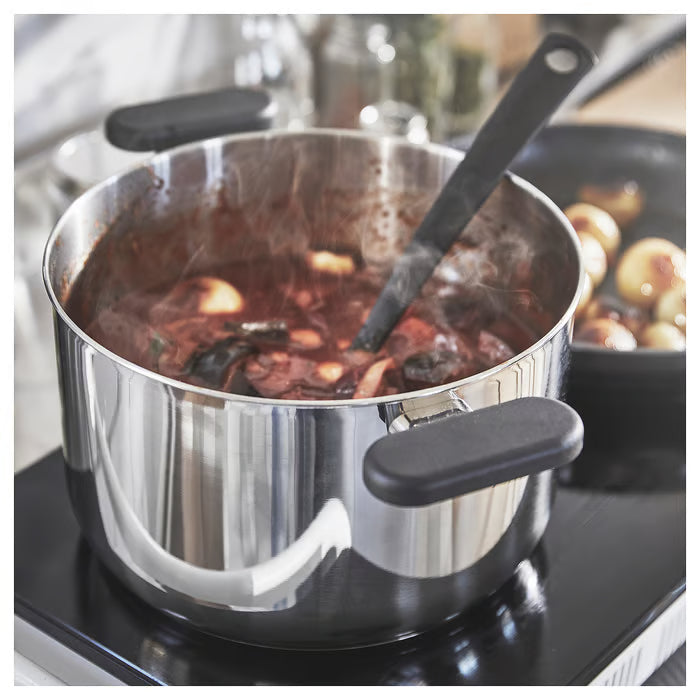 IKEA MIDDAGSMAT stainless steel pot boiling food on stove with steam visible