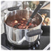 IKEA MIDDAGSMAT stainless steel pot boiling food on stove with steam visible