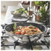 IKEA MIDDAGSMAT wok with noodles and vegetables on stovetop