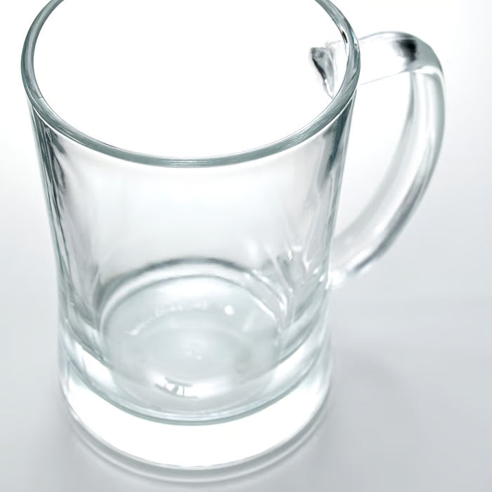 IKEA MJÖD clear glass beer tankard side view showing tapered shape and foam head