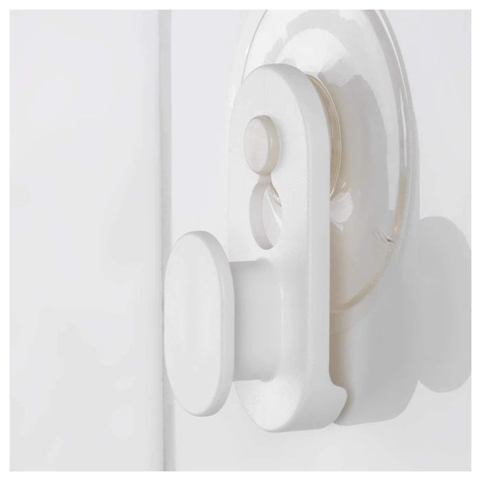  IKEA GLÖMSTA suction cup hooks holding kitchen utensils on glass surface