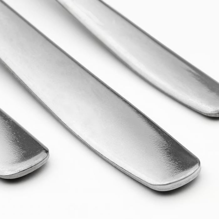 IKEA MOPSIG 12-piece cutlery set three polished stainless steel pieces close-up reflective finish