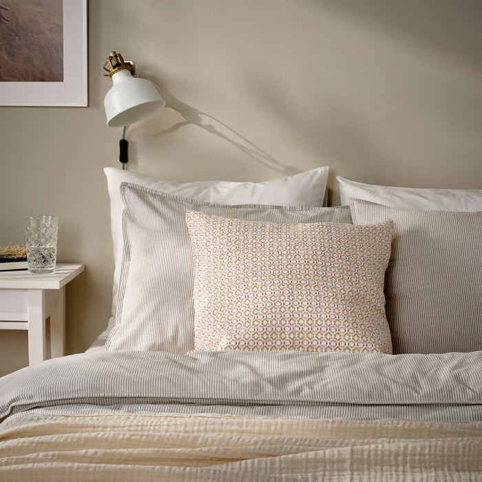 Scandinavian-style cushion cover in a subtle white and light pink geometric pattern, freshening up home decor. 30571098