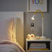 NÄVLINGE LED desk lamp in yellow/white on a Bedside table-30574718