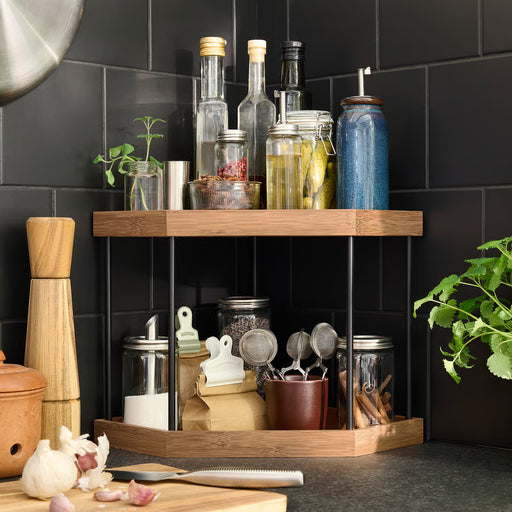 IKEA NÅLBLECKA wooden corner kitchen organiser holding jars, bottles and herbs on a countertop