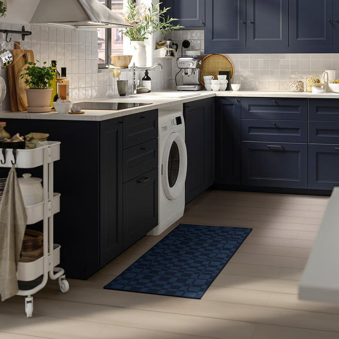 IKEA NATTÅG blue check kitchen mat placed beside washing machine in modern kitchen