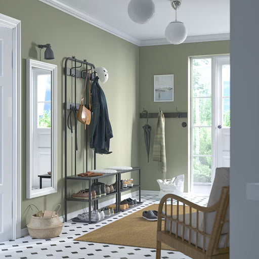  IKEA NIPÅSEN black shoe bench in lime-green hallway styled with coat rack hooks jackets and baskets