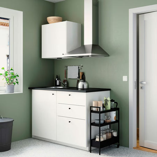 IKEA NISSAFORS black trolley with mesh shelves styled in a modern kitchen beside cabinets