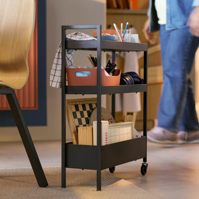 IKEA NISSAFORS black trolley styled as bedside table alternative in bedroom setting