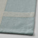 Close-up of IKEA NISSÖGA tablecloth woven cotton-jute blend in blue and beige