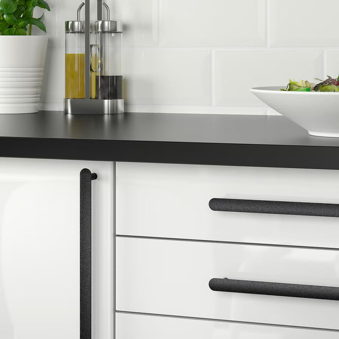IKEA NYDALA black handles fitted on white kitchen drawers, modern setting