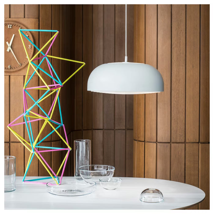  IKEA NYMÅNE white pendant lamp styled over dining setup with glassware and decorative objects