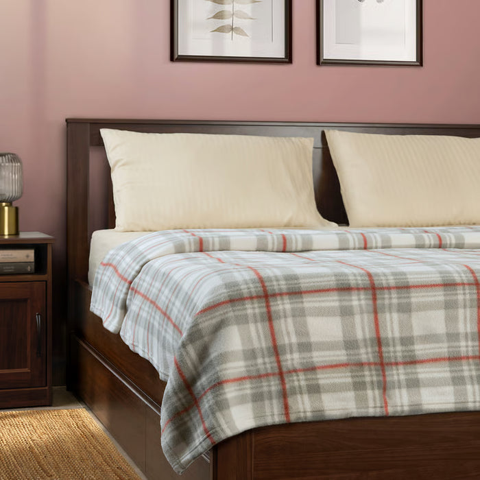 IKEA ODENSLÄTA check pattern blanket spread over a bed, large chequered design