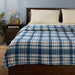 IKEA ODENSLÄTA blue and red check blanket spread over bed with white sheets