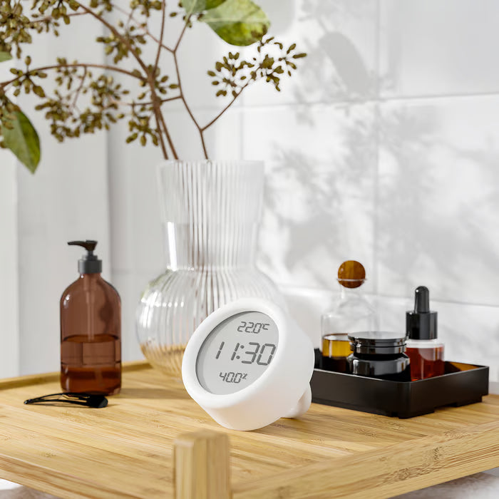 IKEA ÖRNVRÅK round white digital clock 8cm front view displaying time temperature and humidity