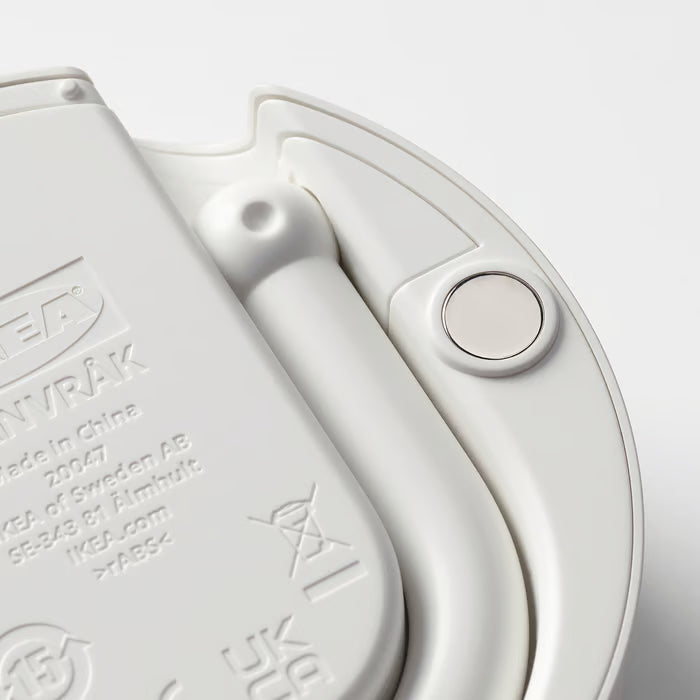 Close-up of IKEA ÖRNVRÅK white clock back showing built-in neodymium magnet for metal surface mounting
