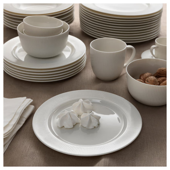 IKEA OFANTLIGT white dinnerware set with bowls plates and cups styled on dining table