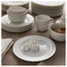 IKEA OFANTLIGT white dinnerware set with bowls plates and cups styled on dining table