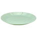 A round, light green ceramic plate with a glossy finish and a smooth surface, ideal for serving meals or snacks."