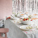  IKEA OFTAST white serving bowls styled on festive table setting with glasses and confetti