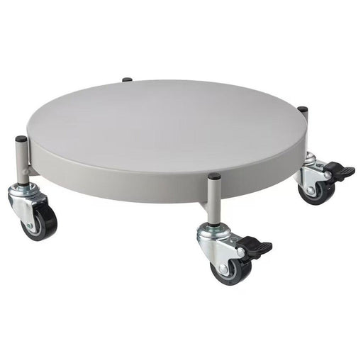 The IKEA OLIVBLAD plant mover being used to transport a heavy planter, emphasizing its strength and ease of use. 30561315
