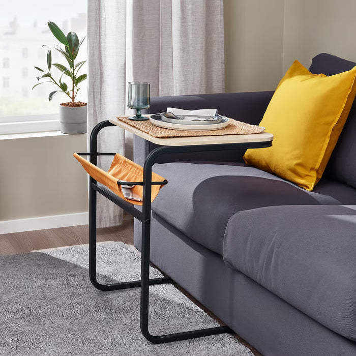 IKEA OLSERÖD side table used as laptop table beside bed with floor lamp and plant