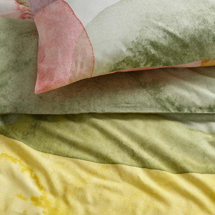 Close-up of IKEA OLYMPTISTEL duvet cover showing its vibrant watercolor design