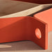 IKEA OMMJÄNGE red wooden tray with rounded handle on textured cloth, close-up finish