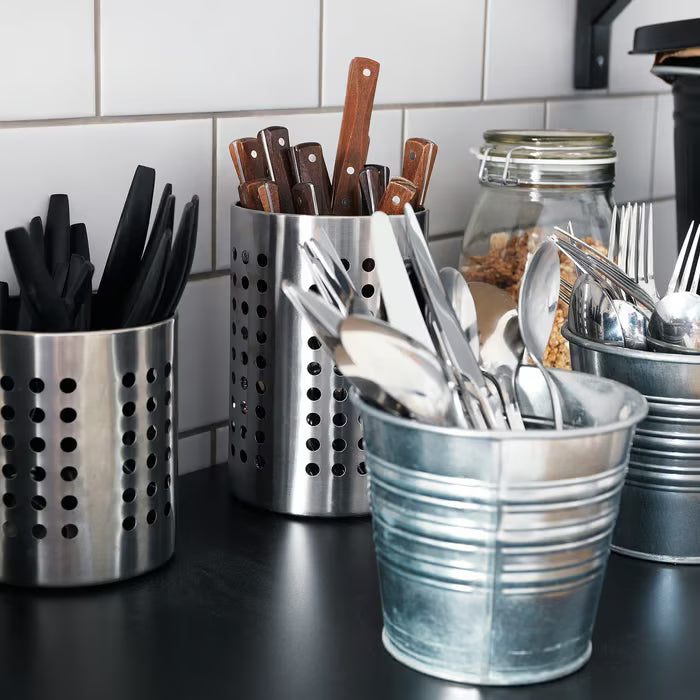 IKEA ORDNING utensil rack close-up showing open cylindrical design and steel finish