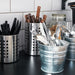 IKEA ORDNING utensil rack close-up showing open cylindrical design and steel finish