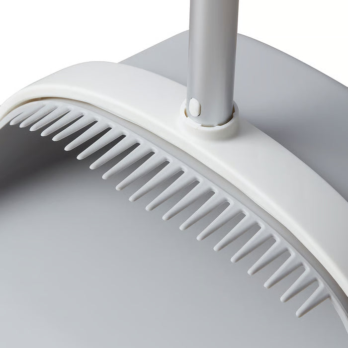 Close-up of IKEA PEPPRIG dustpan toothed edge used to clean broom bristles grey plastic detail