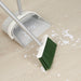  IKEA PEPPRIG dustpan and broom set on wooden floor with white confetti showing folded dustpan in use