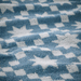 "Close-up of the IKEA PILGULDMAL guest towel, dark grey-blue with a white stripe pattern.-50585749
