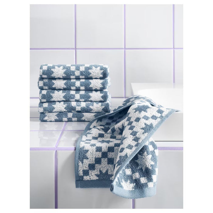 "IKEA PILGULDMAL guest towel in dark grey-blue and white, neatly folded with a clean, modern design.50585749
