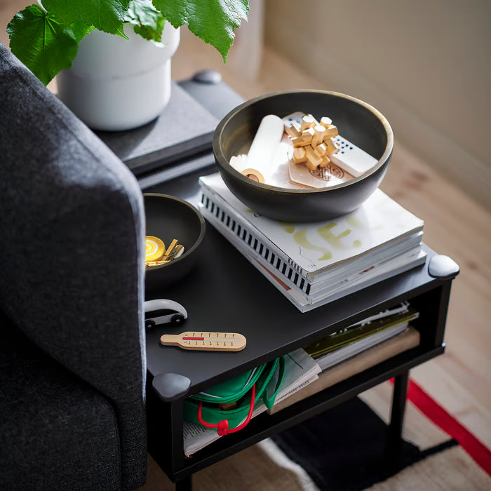 IKEA PINNLILJA acacia bowls on black table styled with snacks in a living room setting