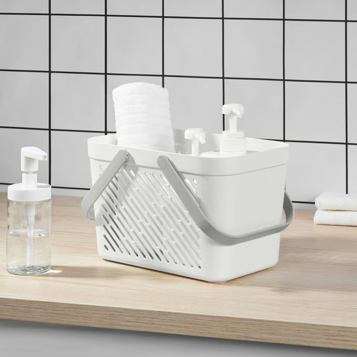  IKEA RÅNEN white bathroom storage basket holding towels and dispensers with air-circulation holes on sides