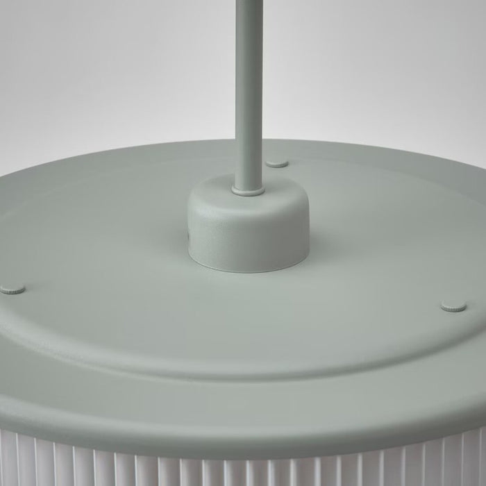 Close-up of the pleated shade on the grey-green IKEA REMTÅNG pendant lamp