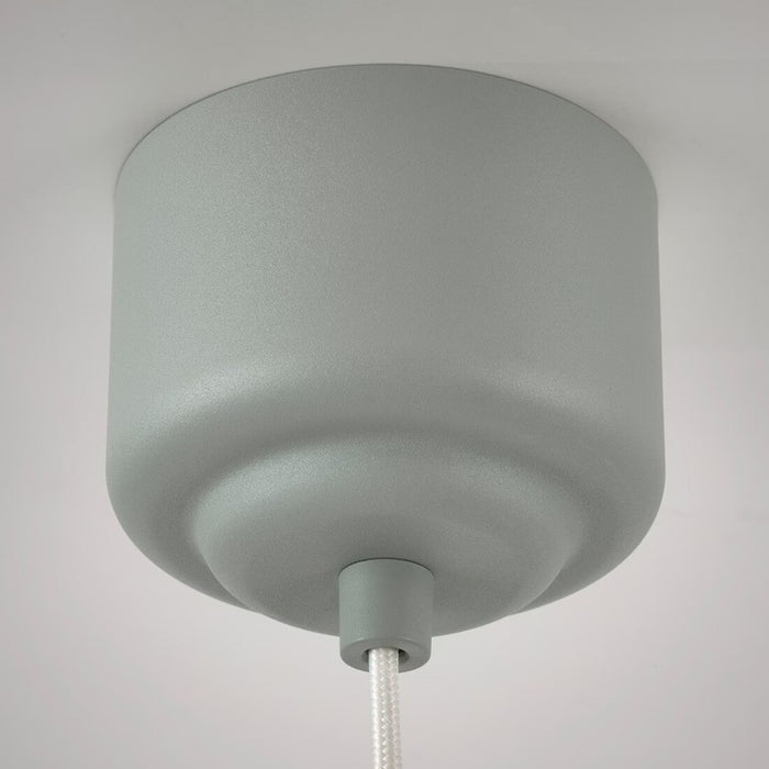 Close-up of the grey-green pleated lampshade of the IKEA REMTÅNG pendant lamp