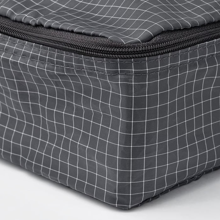  Close-up of IKEA RENSARE grey check packing cube showing sturdy black zip and grid pattern detail