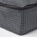  Close-up of IKEA RENSARE grey check packing cube showing sturdy black zip and grid pattern detail