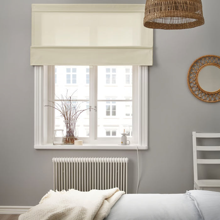 IKEA RINGBLOMMA beige roman blind on bedroom window with woven light fixture and circular mirror