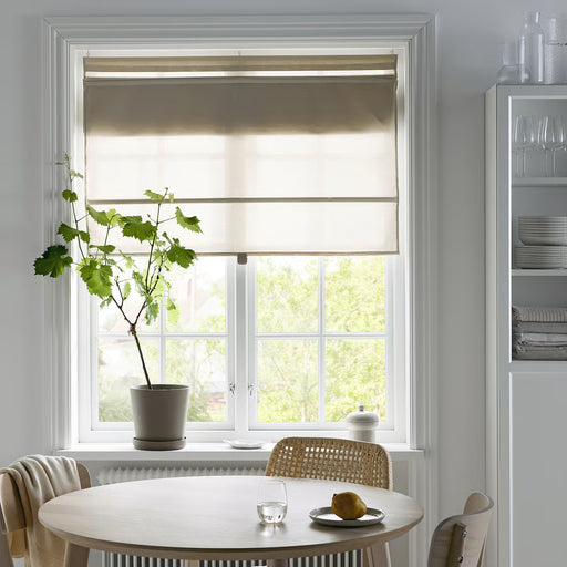 IKEA RINGBLOMMA beige roman blind styled in modern dining room with wicker chairs and shelves