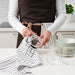  IKEA RINNIG tea towel set of 4 different stripe and check designs displayed on kitchen counter